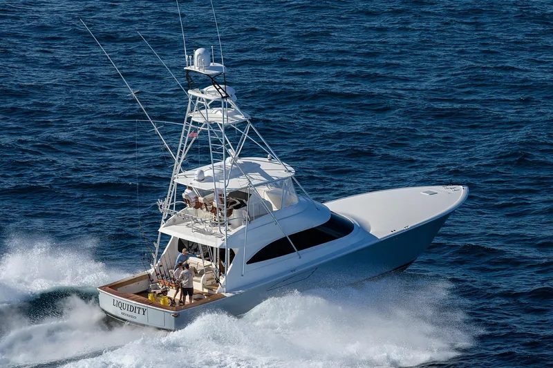  Yacht Photos Pics 2015 Viking 62 Convertible yacht cruising on open ocean waters.