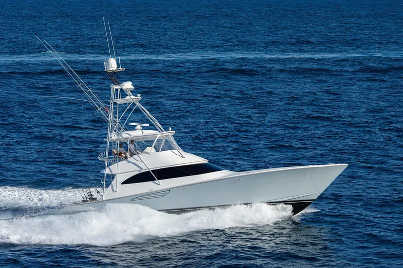  Yacht Photos Pics 2015 Viking 62 Convertible yacht cruising on open ocean waters.