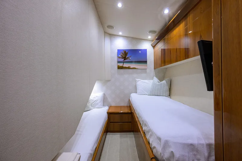  Yacht Photos Pics Cozy twin cabin interior of 2015 Viking 62 Convertible yacht with modern decor.