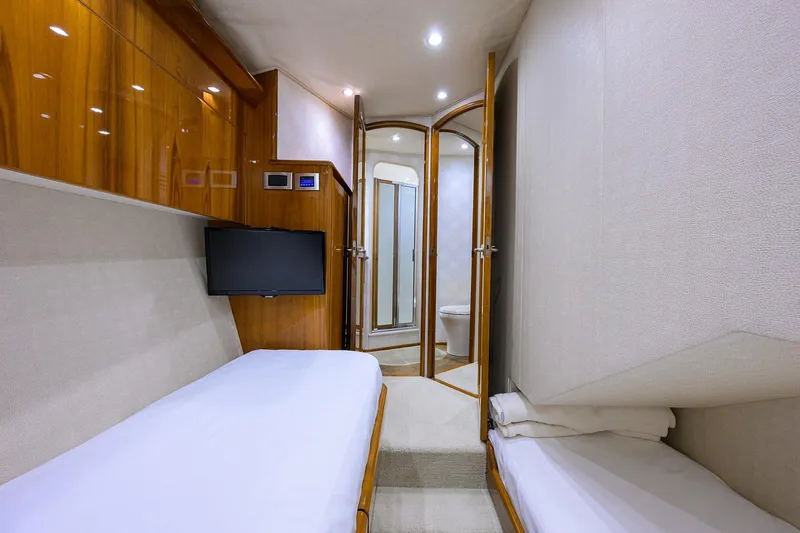  Yacht Photos Pics Luxurious interior of 2015 Viking 62 Convertible yacht with twin beds and ensuite bathroom.