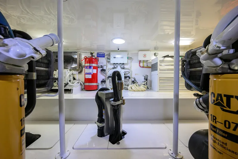  Yacht Photos Pics Engine room of 2015 Viking 62 Convertible yacht with CAT filters and fire extinguisher.