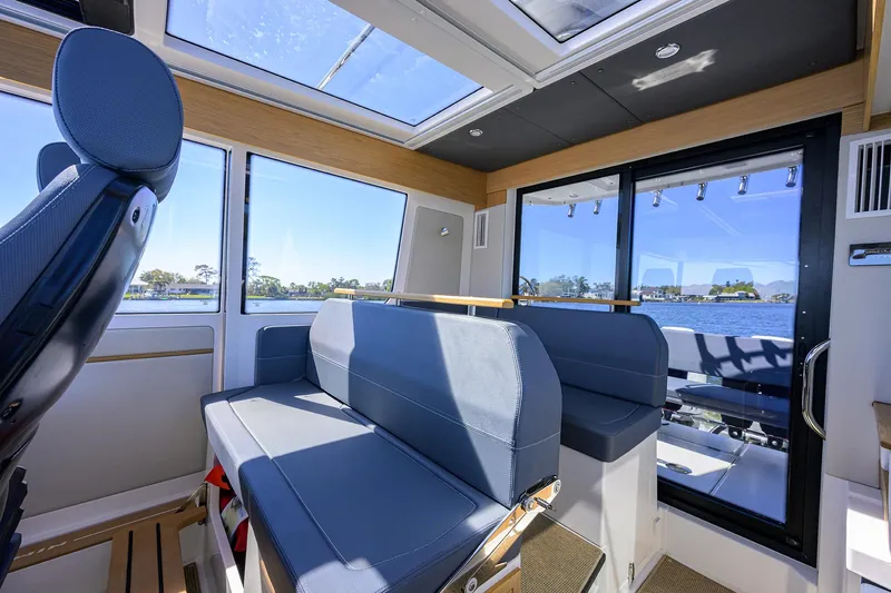 Sea Nn Me III Yacht Photos Pics Interior of 2024 Nimbus C11 boat with modern seating and panoramic windows.