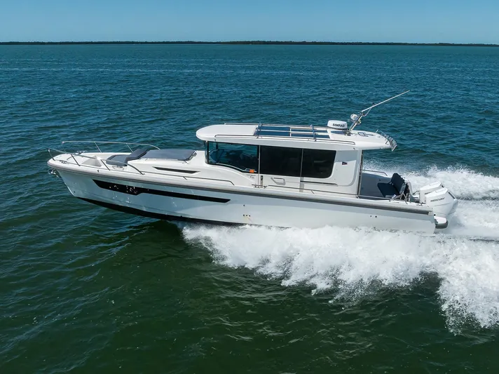 Sea Nn Me III Yacht Photos Pics 2024 Nimbus C11 boat cruising on open water under clear blue skies.