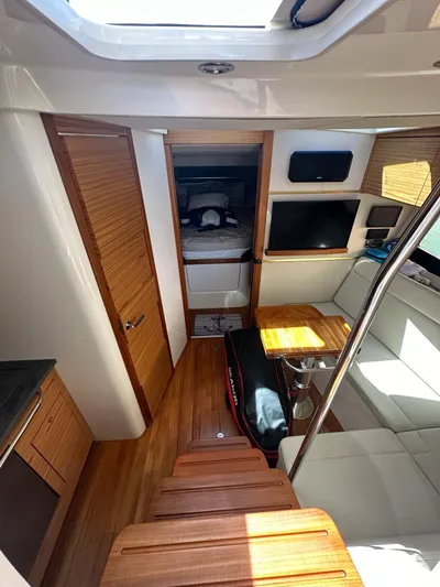  Yacht Photos Pics Interior of 2021 Boston Whaler 405 Conquest, featuring wood accents and modern furnishings.