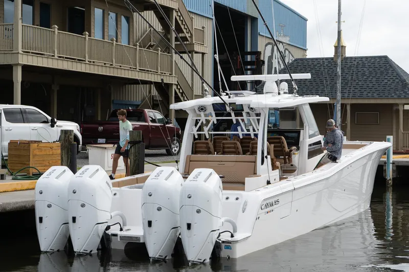  Yacht Photos Pics 2025 Caymas 44 CT boat docked with four powerful outboard engines.
