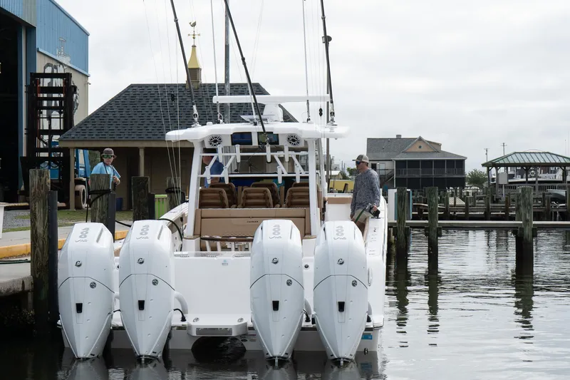  Yacht Photos Pics 2025 Caymas 44 CT boat docked with four powerful outboard engines.