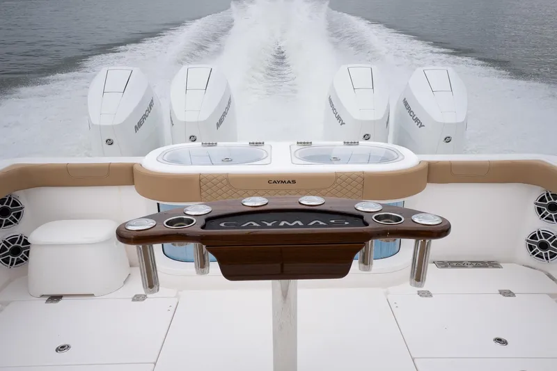  Yacht Photos Pics 2025 Caymas 44 CT boat with powerful Mercury engines on open water.