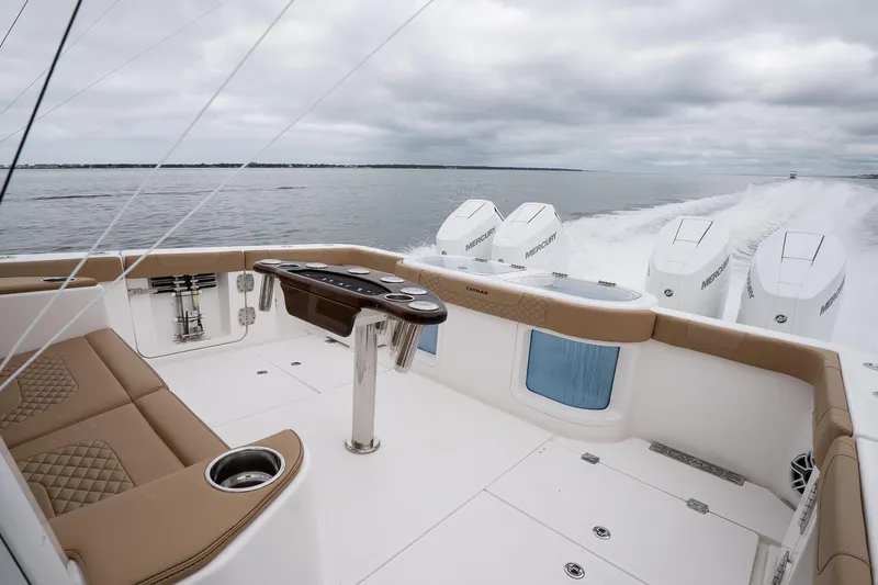  Yacht Photos Pics 2025 Caymas 44 CT boat interior with luxurious seating and powerful outboard engines on open water.