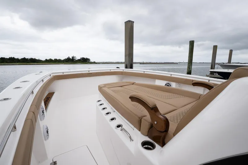  Yacht Photos Pics 2025 Caymas 44 CT boat with tan seating, docked on a cloudy day.