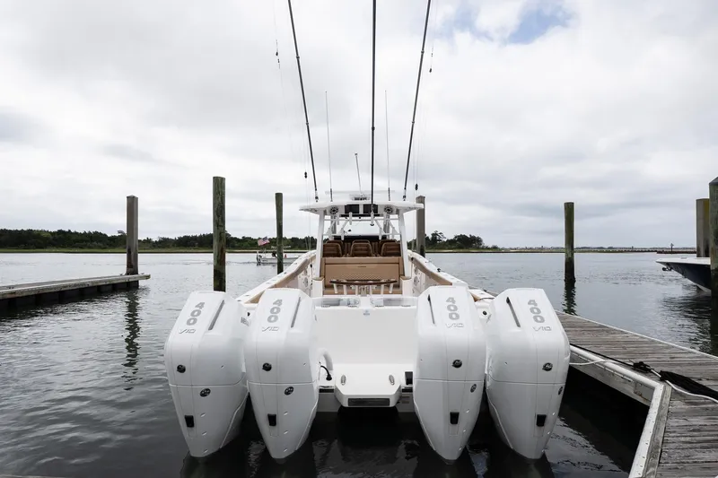  Yacht Photos Pics 2025 Caymas 44 CT boat docked with four powerful outboard engines.