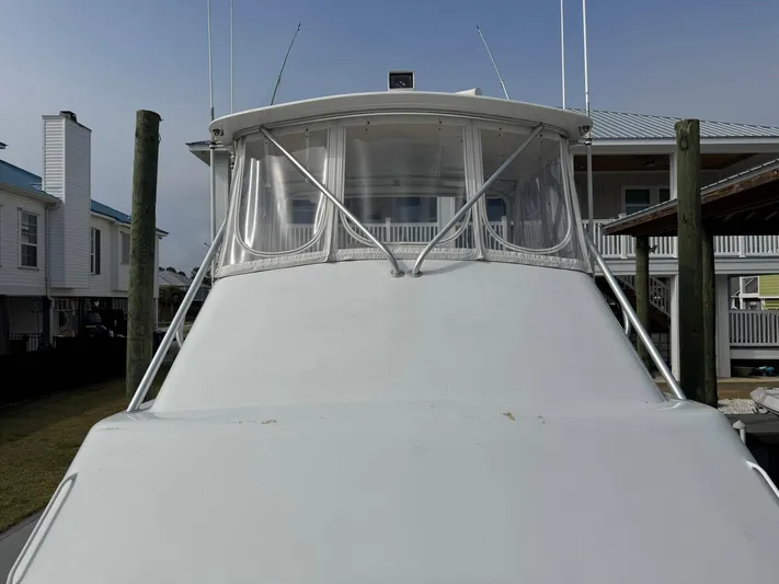 Reel Outlaw Yacht Photos Pics 1998 Richards Yachts Custom Flybridge Sportfish docked near coastal homes.