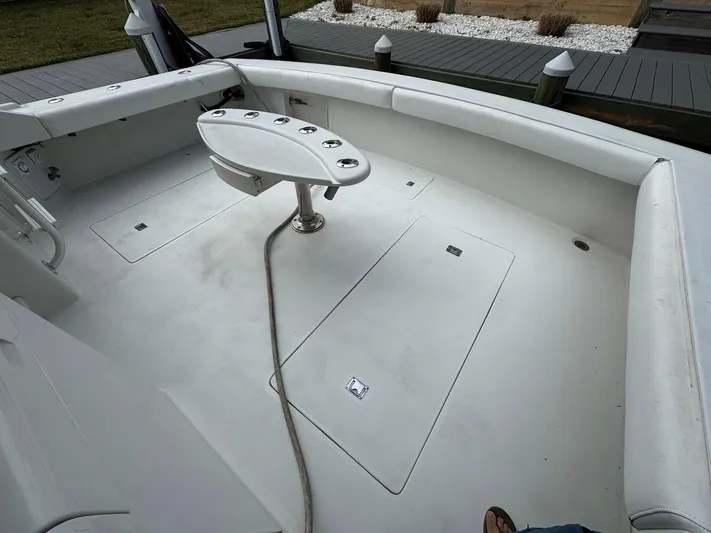 Reel Outlaw Yacht Photos Pics 1998 Richards Yachts Custom Flybridge Sportfish deck with fishing chair and rod holders.