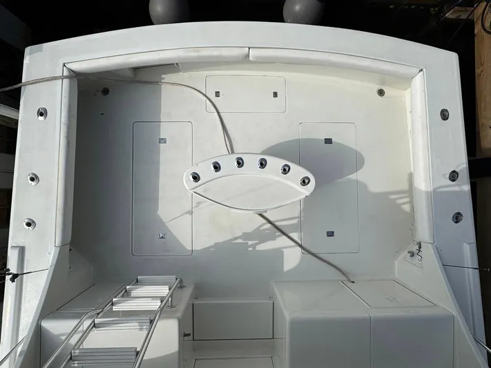 Reel Outlaw Yacht Photos Pics 1998 Richards Yachts Custom Flybridge Sportfish deck with fishing rod holders and storage compartments.