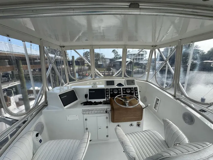 Reel Outlaw Yacht Photos Pics 1998 Richards Yachts Custom Flybridge Sportfish interior with helm, controls, and panoramic windows.