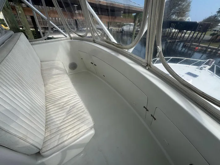 Reel Outlaw Yacht Photos Pics 1998 Richards Yachts Custom Flybridge Sportfish with white seating and panoramic windows.