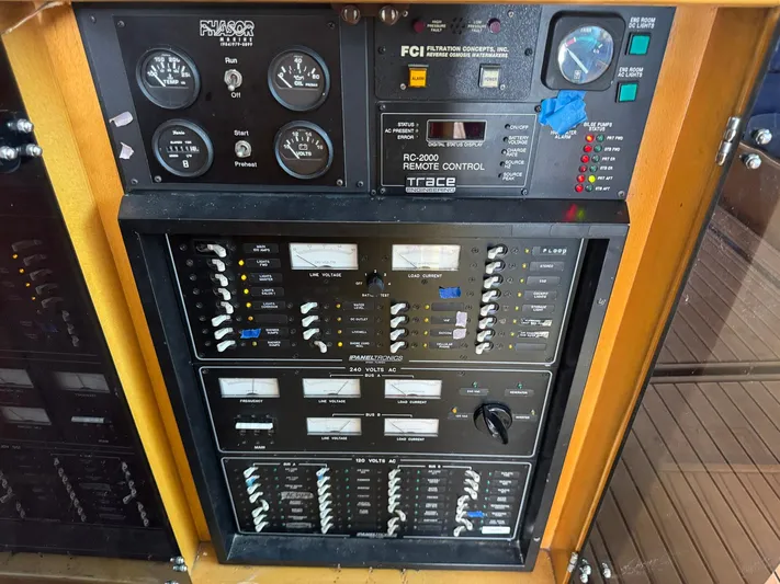 Reel Outlaw Yacht Photos Pics Control panel of a 1998 Richards Yachts Custom Flybridge Sportfish, featuring gauges and switches.