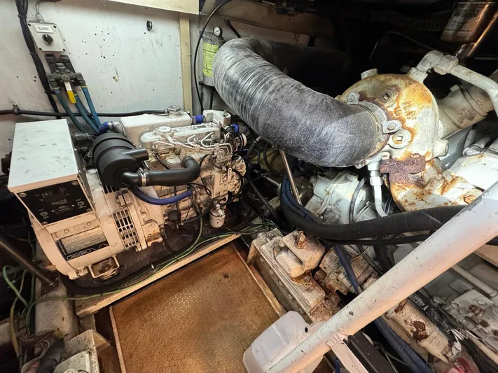 Reel Outlaw Yacht Photos Pics Engine room of 1998 Richards Yachts Custom Flybridge Sportfish, showcasing machinery and components.