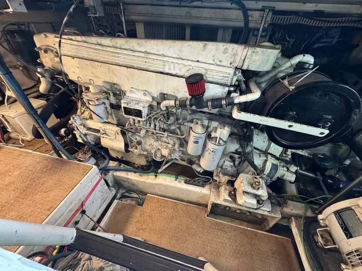 Reel Outlaw Yacht Photos Pics Engine room of 1998 Richards Yachts Custom Flybridge Sportfish, showcasing detailed machinery components.