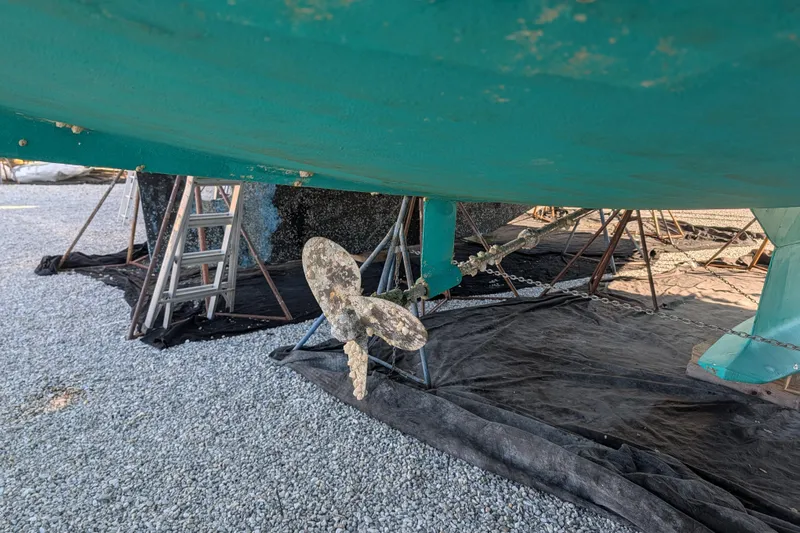 Celebration Yacht Photos Pics Bottom view of a 2001 Tartan 4100 sailboat with visible propeller and keel.