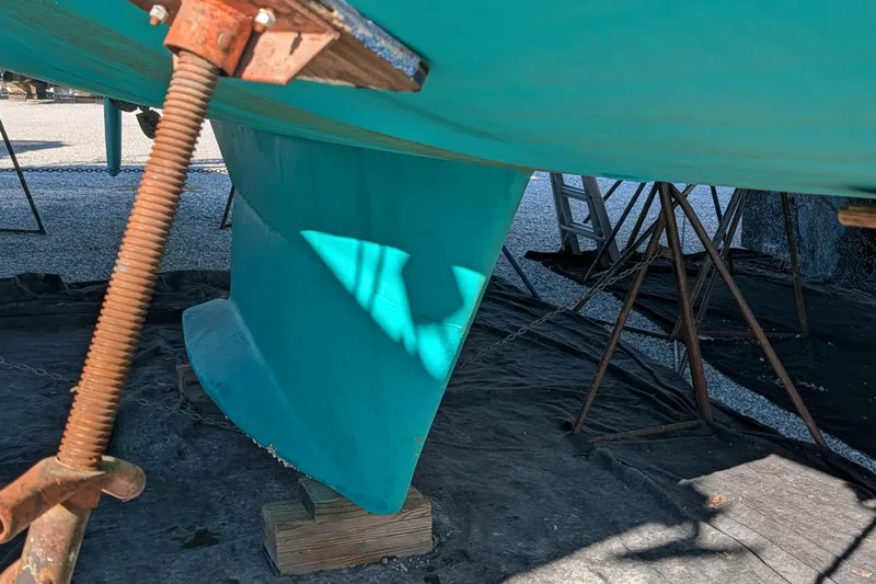 Celebration Yacht Photos Pics Underneath view of a 2001 Tartan 4100 sailboat hull and keel in dry dock.