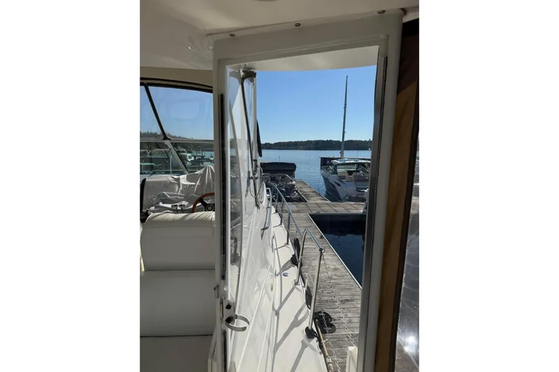 Cato Yacht Photos Pics 2003 Cruisers Yachts 4050 Express docked at marina, sunny day view.