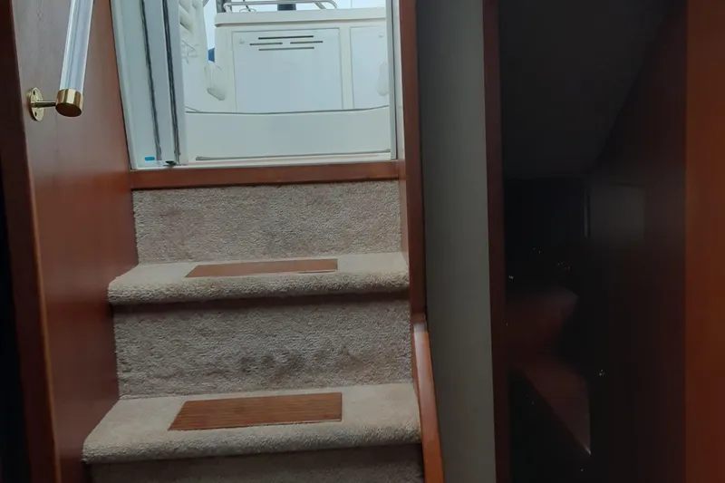 Cato Yacht Photos Pics Staircase inside 2003 Cruisers Yachts 4050 Express, leading to upper deck area.