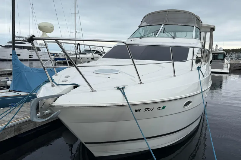 Cato Yacht Photos Pics 2003 Cruisers Yachts 4050 Express docked at marina, front view.