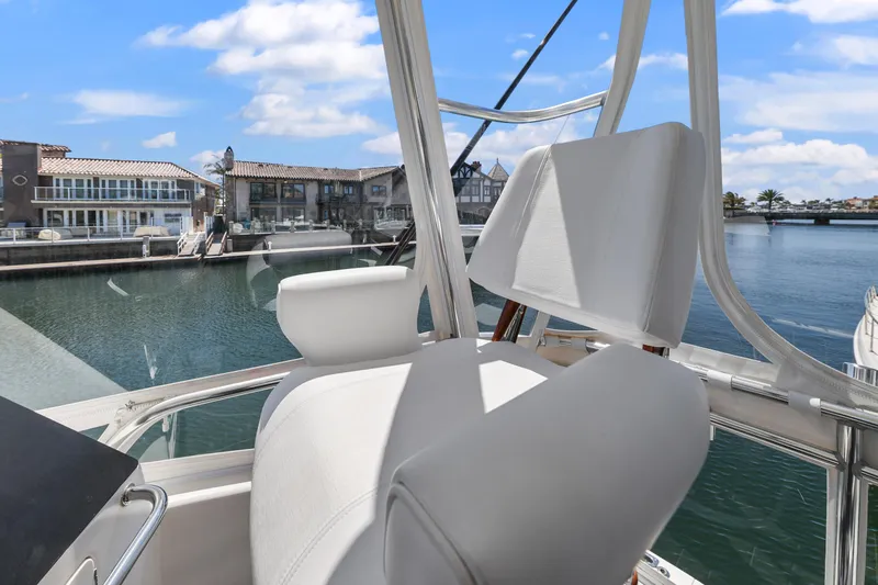 Legacy Yacht Photos Pics Flybridge view from 2004 Cabo 40 Convertible, overlooking marina and waterfront homes.