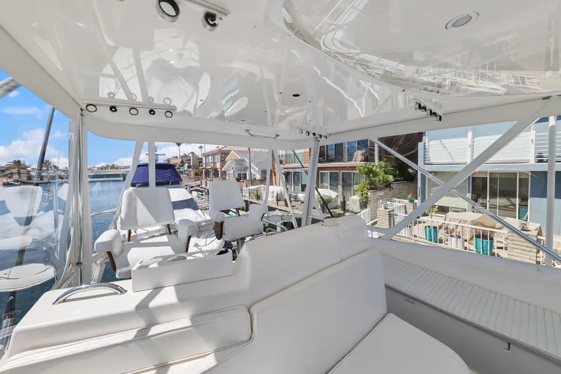 Legacy Yacht Photos Pics 2004 Cabo 40 Flybridge Convertible yacht interior with white seating and waterfront view.