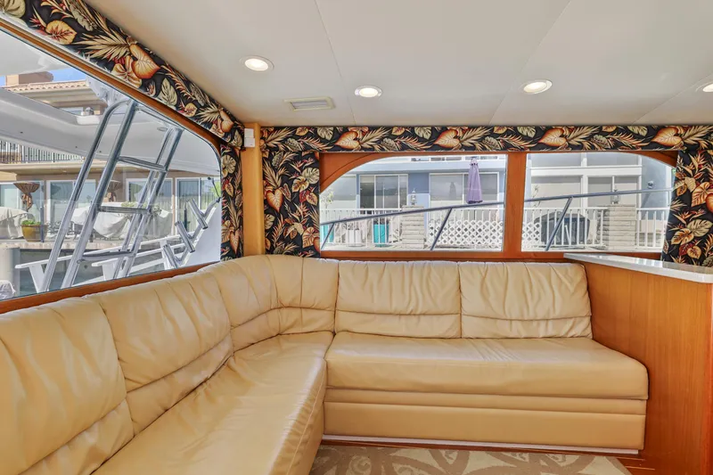 Legacy Yacht Photos Pics Luxurious interior of 2004 Cabo 40 Flybridge Convertible with beige leather seating.