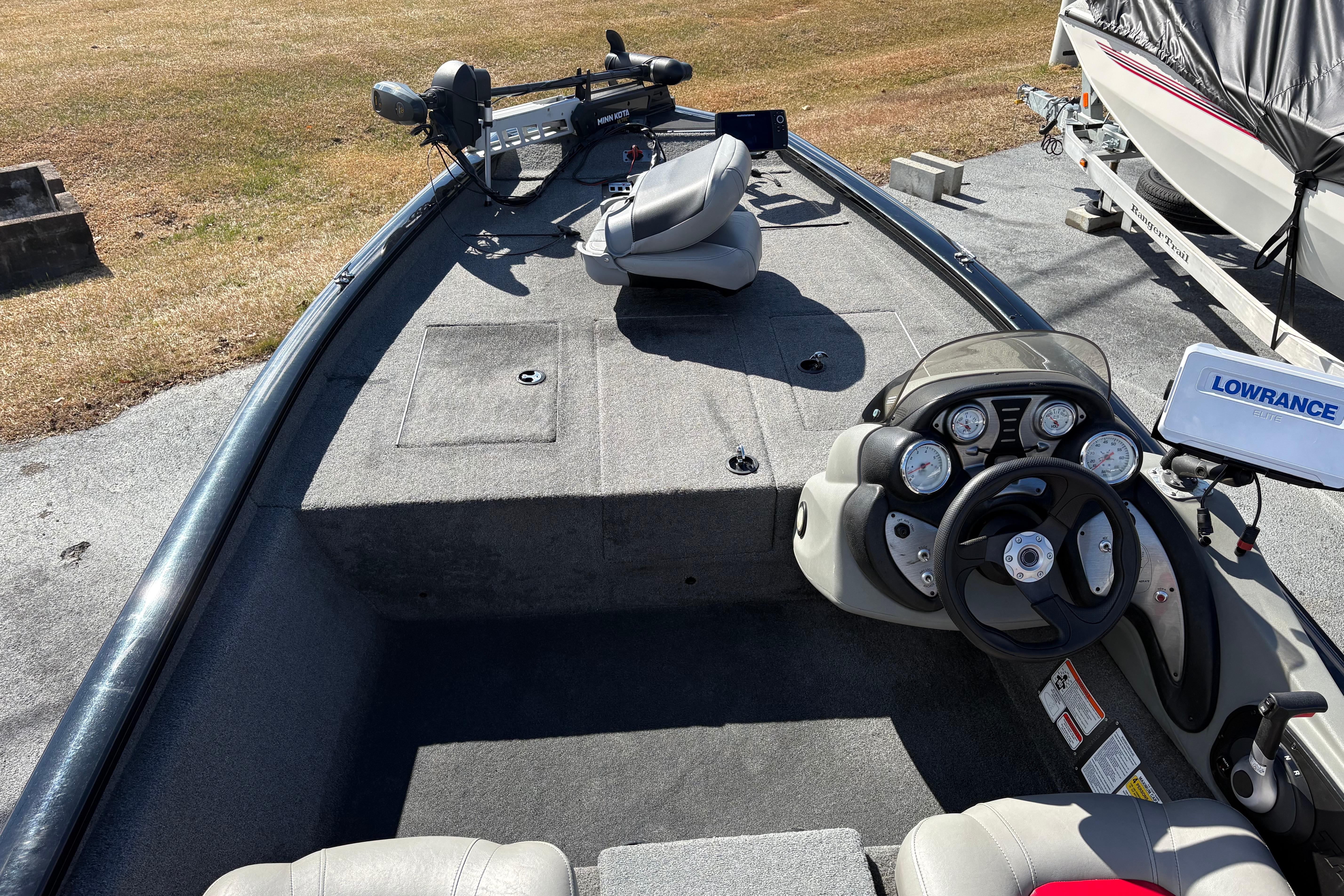 2017 Tracker Pro Team 175 TXW boat interior with steering console and fishing equipment.