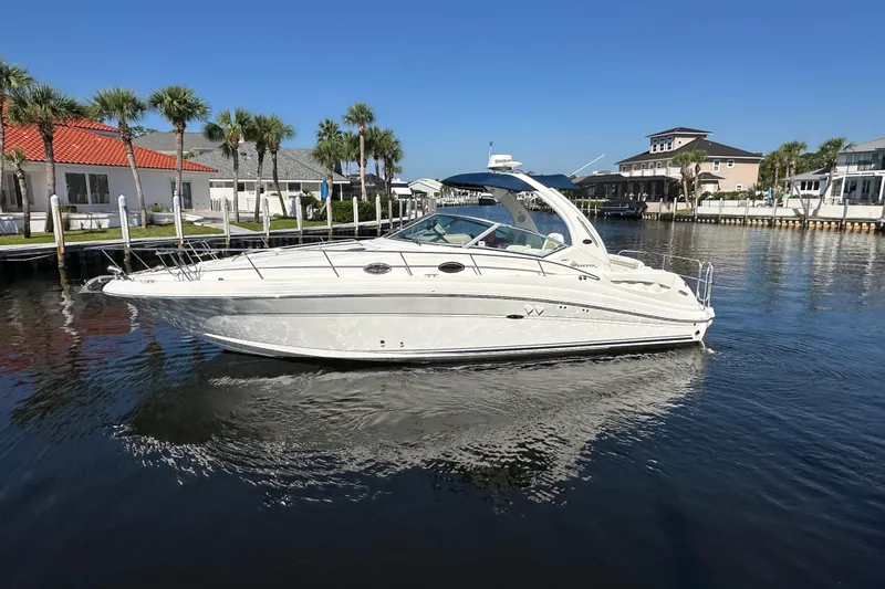 Lonie Marie Yacht Photos Pics 2008 Sea Ray 340 Sundancer yacht docked in a scenic waterfront area.