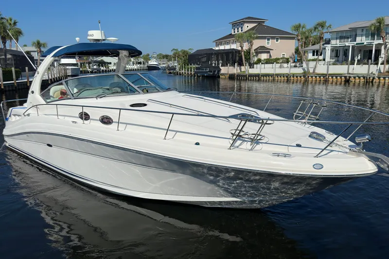 Lonie Marie Yacht Photos Pics 2008 Sea Ray 340 Sundancer yacht docked in a scenic waterfront setting.