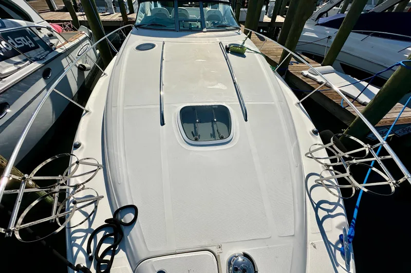 Lonie Marie Yacht Photos Pics 2008 Sea Ray 340 Sundancer yacht docked, showcasing sleek deck design and mooring lines.