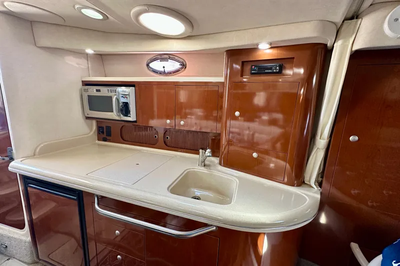 Lonie Marie Yacht Photos Pics 2008 Sea Ray 340 Sundancer interior kitchen with microwave and sink.