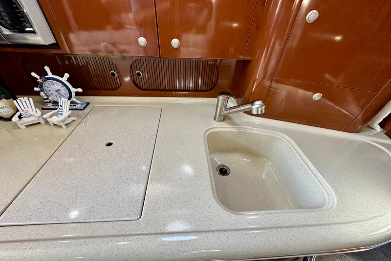 Lonie Marie Yacht Photos Pics Luxurious kitchen area in 2008 Sea Ray 340 Sundancer yacht with sink and decor.