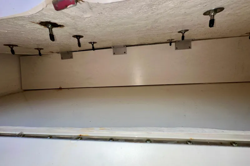 Lonie Marie Yacht Photos Pics Interior compartment of a 2008 Sea Ray 340 Sundancer boat, showing screws and brackets.