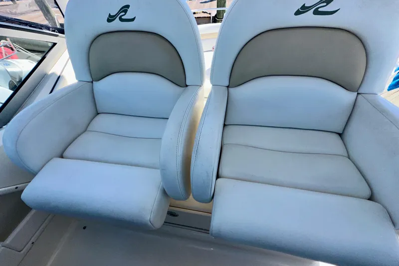 Lonie Marie Yacht Photos Pics 2008 Sea Ray 340 Sundancer boat seats, white and beige upholstery, with logo detail.