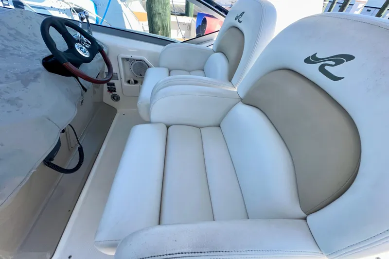 Lonie Marie Yacht Photos Pics 2008 Sea Ray 340 Sundancer cockpit with white leather seats and steering wheel.