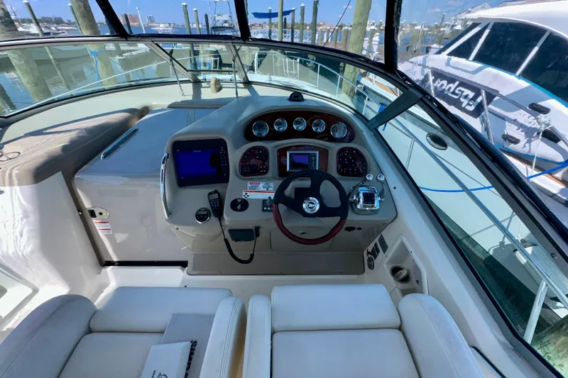 Lonie Marie Yacht Photos Pics 2008 Sea Ray 340 Sundancer helm with modern controls and navigation system.