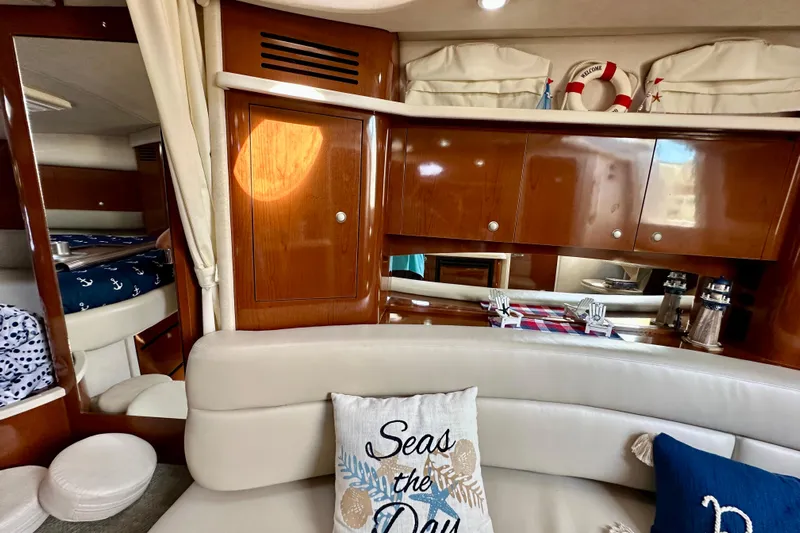 Lonie Marie Yacht Photos Pics Interior of 2008 Sea Ray 340 Sundancer yacht with wooden cabinets and nautical decor.