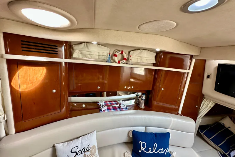 Lonie Marie Yacht Photos Pics Interior of 2008 Sea Ray 340 Sundancer yacht with wooden cabinets and cozy seating.