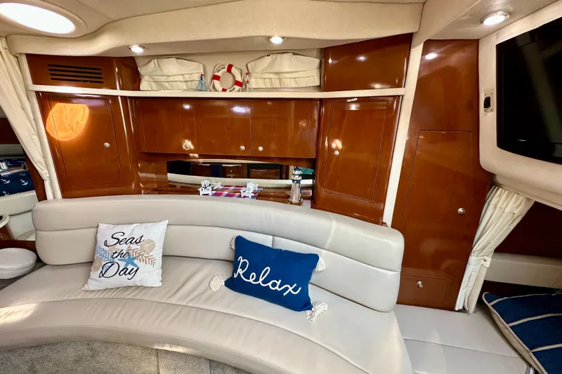 Lonie Marie Yacht Photos Pics Luxurious interior of 2008 Sea Ray 340 Sundancer with plush seating and nautical decor.