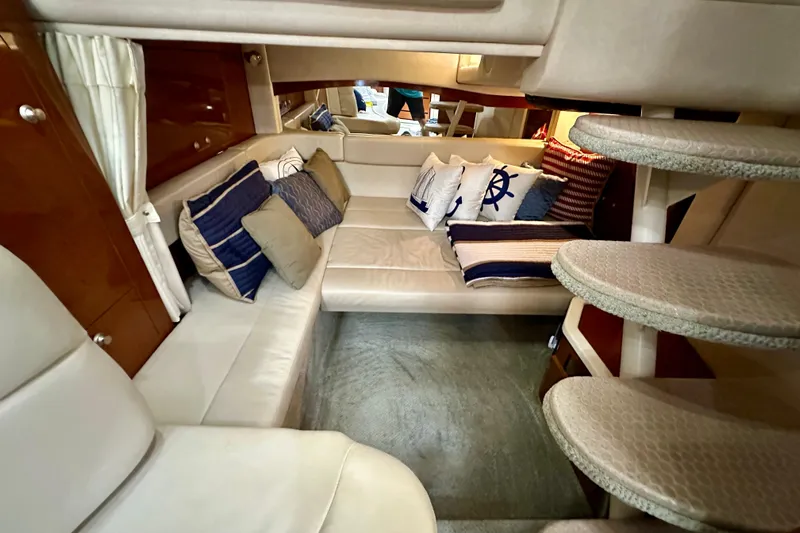Lonie Marie Yacht Photos Pics Interior of 2008 Sea Ray 340 Sundancer with cozy seating and nautical-themed cushions.