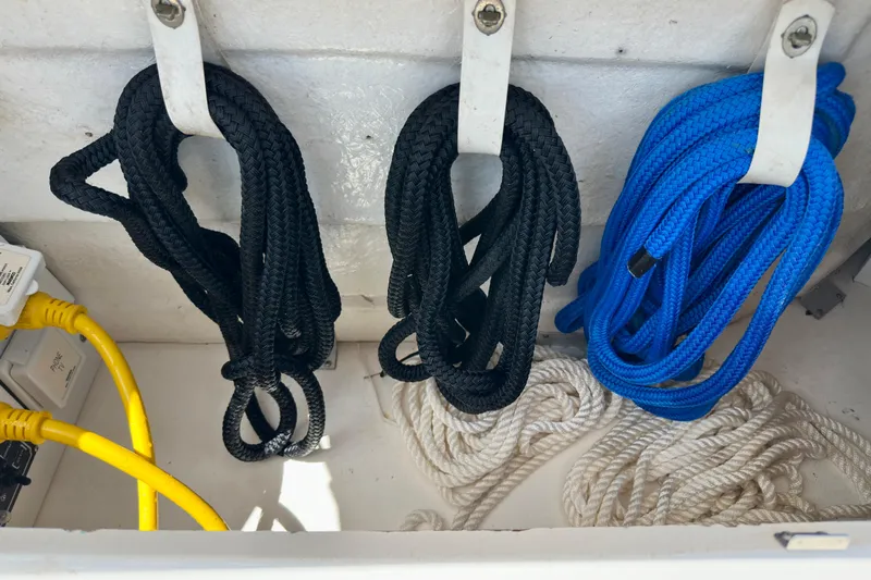 Lonie Marie Yacht Photos Pics Coiled ropes and cables in a 2008 Sea Ray 340 Sundancer storage compartment.