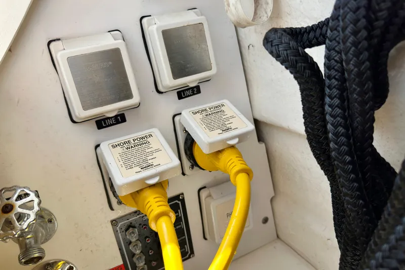 Lonie Marie Yacht Photos Pics Shore power connections on a 2008 Sea Ray 340 Sundancer boat with yellow cables.