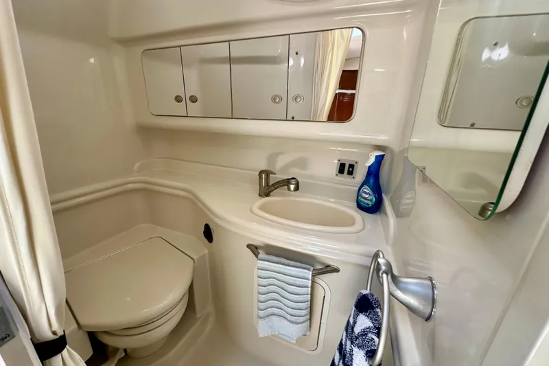 Lonie Marie Yacht Photos Pics Bathroom interior of 2008 Sea Ray 340 Sundancer yacht, featuring sink and toilet.