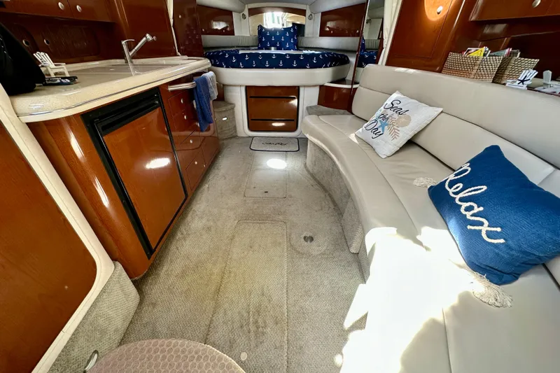 Lonie Marie Yacht Photos Pics Luxurious interior of 2008 Sea Ray 340 Sundancer with cozy seating and elegant wood finishes.