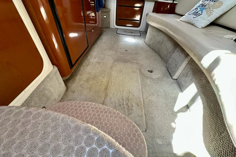 Lonie Marie Yacht Photos Pics Interior of 2008 Sea Ray 340 Sundancer with carpeted flooring and wooden cabinetry.
