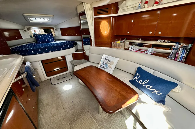 Lonie Marie Yacht Photos Pics Luxurious interior of 2008 Sea Ray 340 Sundancer yacht with cozy seating and nautical decor.